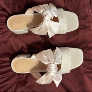 Beautiful slip on dress shoes with bow. Wore once. Excellent condition.